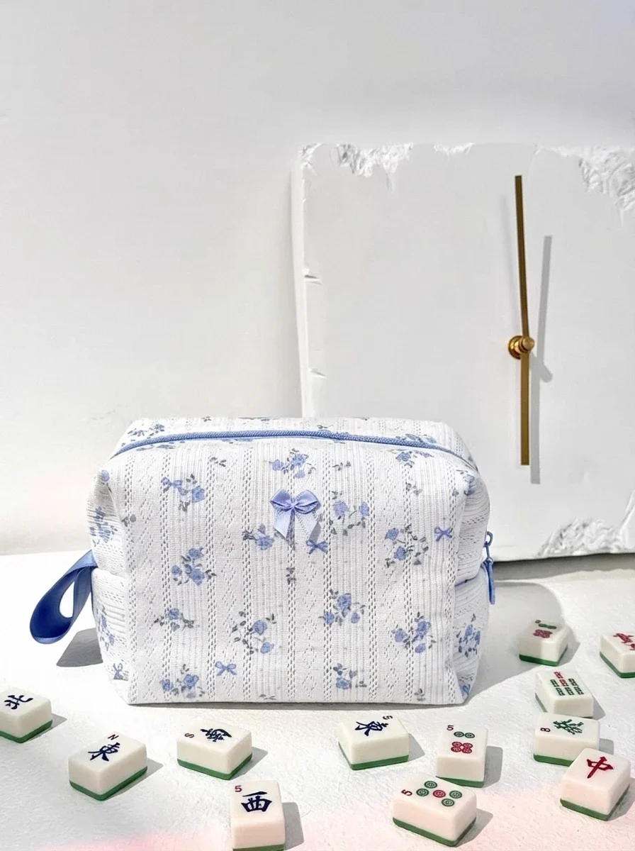 Blue floral mahjong tiles bag on table ready for mahjong game night