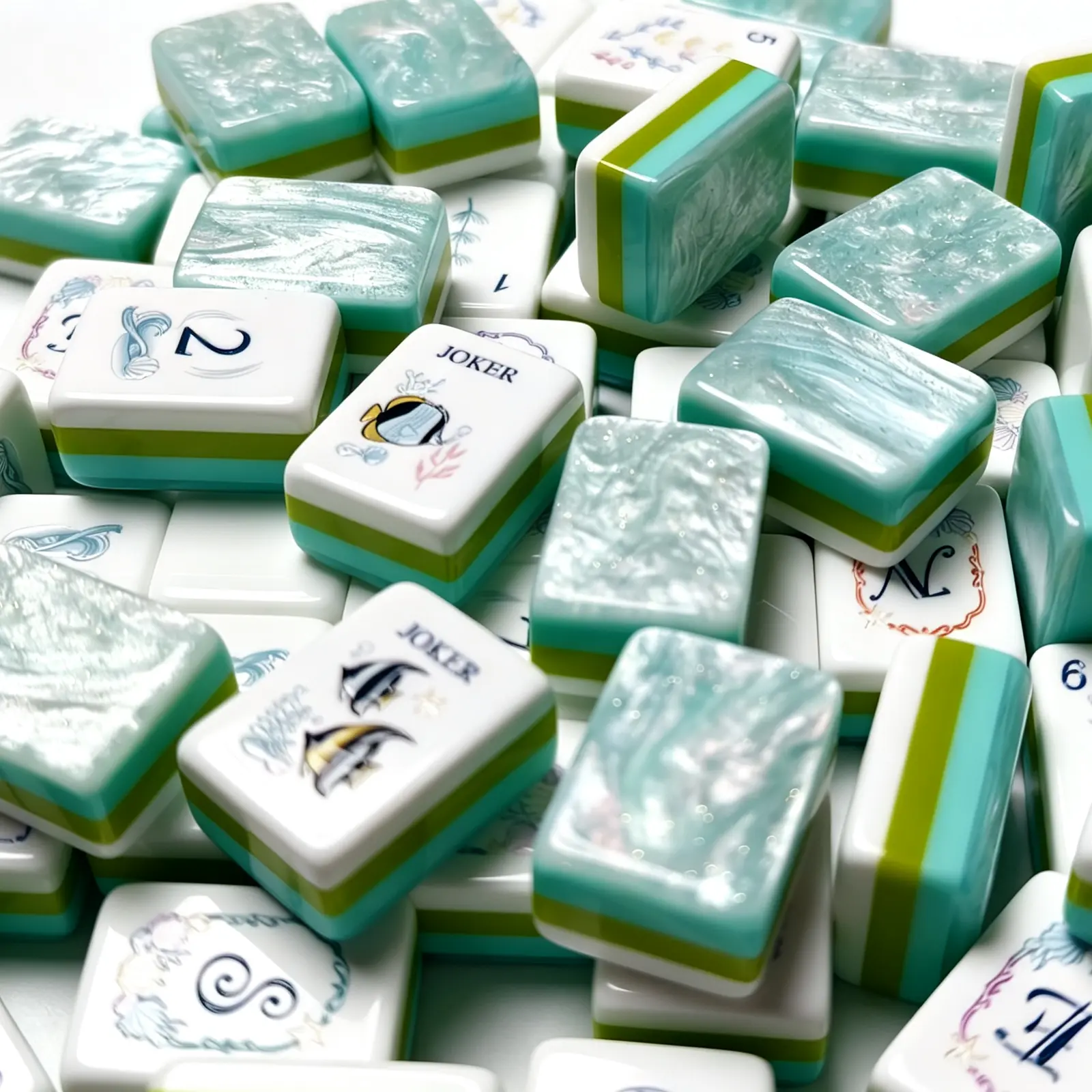 Close-up of Reef Kiss 3-layer acrylic mahjong tiles highlighting textured aqua backs and polished edges