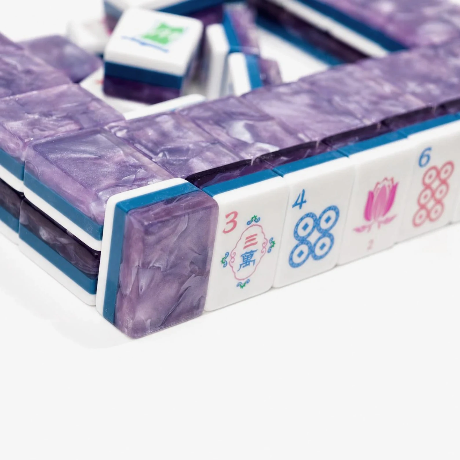 Close-up of Purple Sanctuary Mahjong Tiles featuring transparent purple cloud acrylic layers
