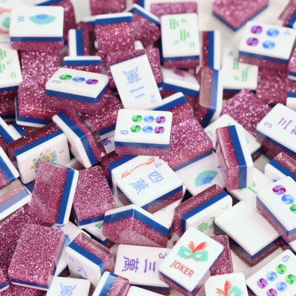 Pink Stardust Glitter Mahjong tiles set with sparkling glitter backs scattered across a table